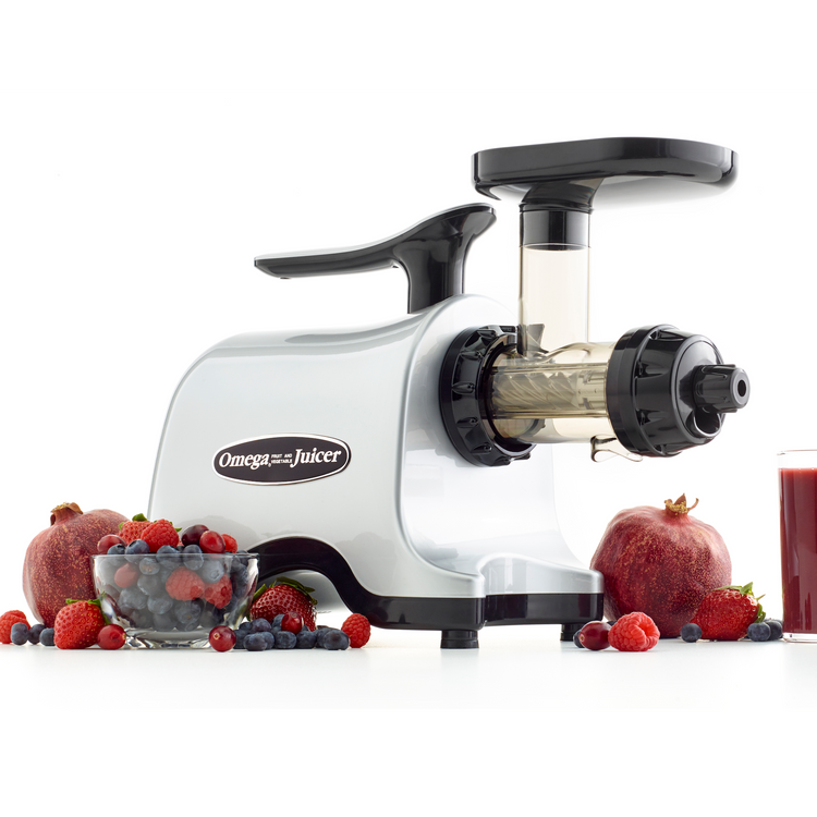 Triturating juicer outlet